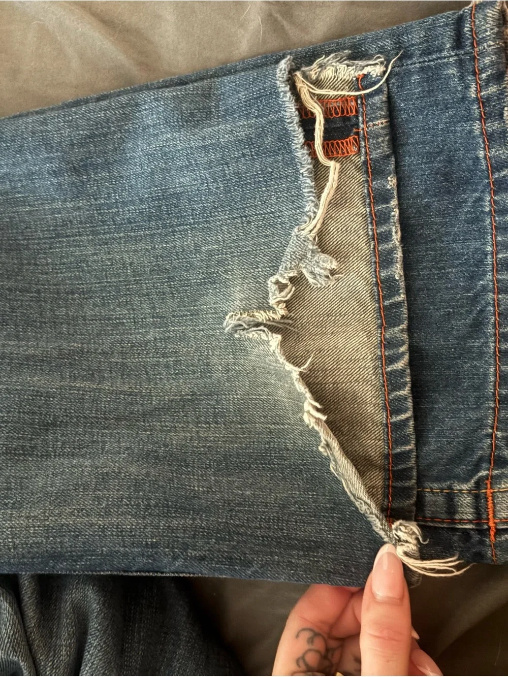 True Religion Men's Straight Jeans in Medium Blue with Distressed Hem